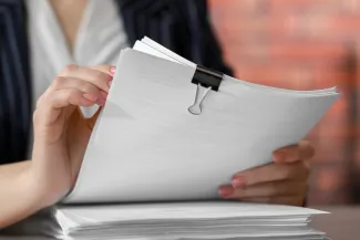 Woman holding documents