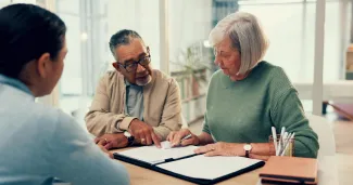 Older couple completing estate planning