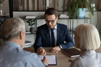 Couple talking with lawyer