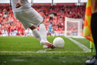 Person kicking a football
