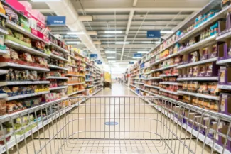 Supermarket trolley in aisle