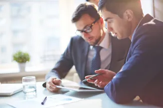 Two business men looking at tablet