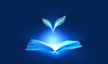 Blue book with plant growing from it