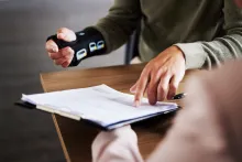 Injured man pointing at a document 